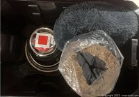 Overview of dog beds, food bowls, and additional dog accessory items in black container.