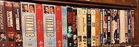 Shelf of various VHS tapes including Titanic, The Long Riders, The Chamber and more.