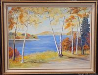 Front view of the framed signed oil painting depicting a landscape with lake, trees, and distant hills.