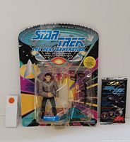 Star Trek The Next Generation Romulan collectible figurine in original blister card packaging with branding and starship imagery.