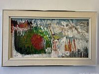 Front view of the abstract painting framed and hanging on the wall showing composition and colors.