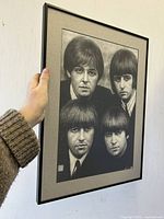 Framed black and white art print showing all four Beatles members.