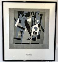 Framed full view of Picasso serigraph print showing two stylized figures in grayscale Cubist style with 'PICASSO' text below.
