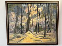 Frontal view of the signed northern landscape oil painting on board inside a dark wood and gold trim frame.