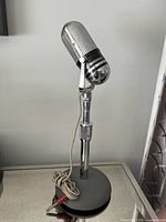 Full view of microphone mounted on stand with cable