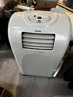 Front view of Danby portable air conditioner showing vent louvers and control panel on top.