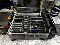 Top view of KitchenAid grey dish drying rack showing flatware caddy and multiple compartments.