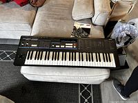 Overhead view of synthesizer on ottoman