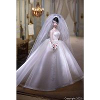 Full front view of Maria Therese Barbie bridal doll dressed in white satin and organza gown with veil and bouquet.