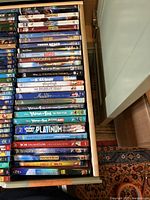 Wide view of Disney and other Blu-Ray discs stacked in a drawer, showing titles and colorful spines
