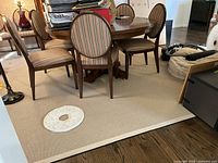 Full view of rug under dining table showing overall size and placement