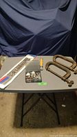Full lot contents showing all tools on table including socket organizers, rotary bits, roller and C-clamps