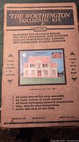 Photo of the original box of The Worthington Dollhouse Kit by Artply, showing product details and features.