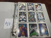 Page of nine Incredible Hulk trading cards showing front artwork with vibrant comic-style images of different characters and scenes.