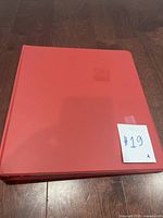 Red binder with a label #19 showing the storage for the card collection.