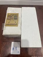 Two white cardboard boxes labeled '1992 Fleer B.B. Complete' with gold-bordered baseball cards taped to the outside, showing players including Kenny Lofton.