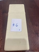 Cream plastic View-Master protective case closed with label #6 on top