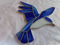 Front view of stained glass bluebird showing colors and design