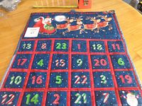 Front view showing full calendar with pockets and graphic