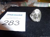 Frontal view of Moongod sterling ring on display pad