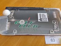Front of sealed Golf Club license plate frame showing design and shrink wrap