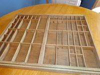 Full view of wooden type drawer with compartments