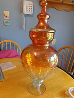 Full view of jar with lid on tabletop