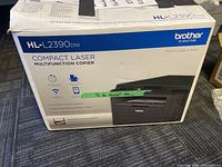 Sealed retail box labeled HL-L2390DW Compact Laser Multifunction Copier