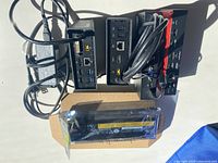 Overview of three docking stations and battery laid out