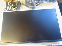 Front view of the ViewSonic gaming monitor showing its unpowered display and ViewSonic logo on the bottom bezel.