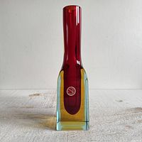 Front view of rectangular Murano Sommerso style vase showing red interior with amber and blue outer layers and original round sticker