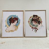 Full view of both framed prints showing two different lady head artworks with ornate floral details.