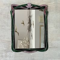 Front view of the stained glass mirror showing its full frame and clear reflective glass.