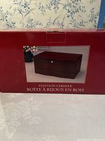 Original box with image of the jewelry box showing cherry finish and rectangular shape