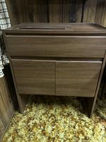Front view of vintage wooden desk showing solid wood build, two-door cupboard underneath, and smooth finish