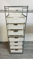 Front view of the IKEA Antonius storage unit with six white fabric drawers in a metal frame.