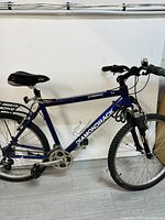Side view of the blue Diamondback mountain bike showing frame, tires, seat, and handlebars
