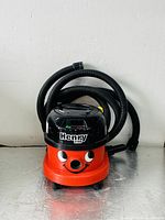 Henry vacuum front view with hoses coiled on top