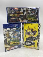 Photo showing three unopened boxes of vintage NASCAR trading cards including 1994 Maxx Race Cards and Maxx Premier Series in blue packaging