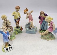 Grouping of six Royal Worcester figurines showing all the children in different poses.