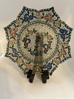 Full view of the round cloisonné enamel plate showing scalloped edges, floral multicolor design with blue, pink, green and white, and overall condition.