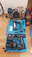 All four tools displayed including Bosch cordless drill in blue case, Bosch corded router, Bosch corded drill, and Makita cordless drill.
