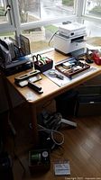 Photo of desk with HP printer, office supplies organizers, stapler, tape dispenser, and folders