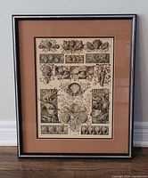 Full view of the framed lithograph against a white wall and wood floor showing the entire artwork with brown mat and black silver frame.