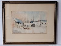 Full view of framed watercolour painting showing rustic buildings with snow and a winter landscape, signed and dated 1917.
