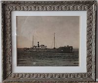 Framed view of antique black and white photo of the Canadian Steamship CSL Maplecourt, showing ship on water, ornate carved frame