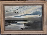 Framed vintage landscape painting with flying birds and water scene.