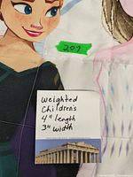 Close-up of the note specifying dimensions and description of the weighted children's blanket.