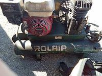 Side view showing Rolair logo on tank, engine, pump and wheels