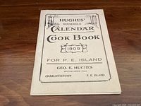 Front cover of the Hughes’ Household Calendar Cook Book 1909 for P.E. Island showing title and publisher Geo. E. Hughes
